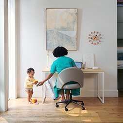 mom working from home with toddler