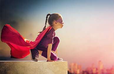 Girl dressed as super hero