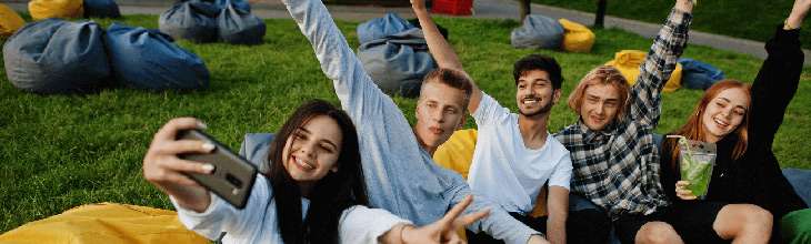 Friends take a selfie in a park