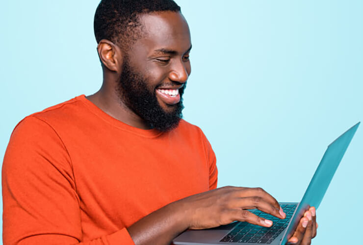 African American man secures his laptop from online threats